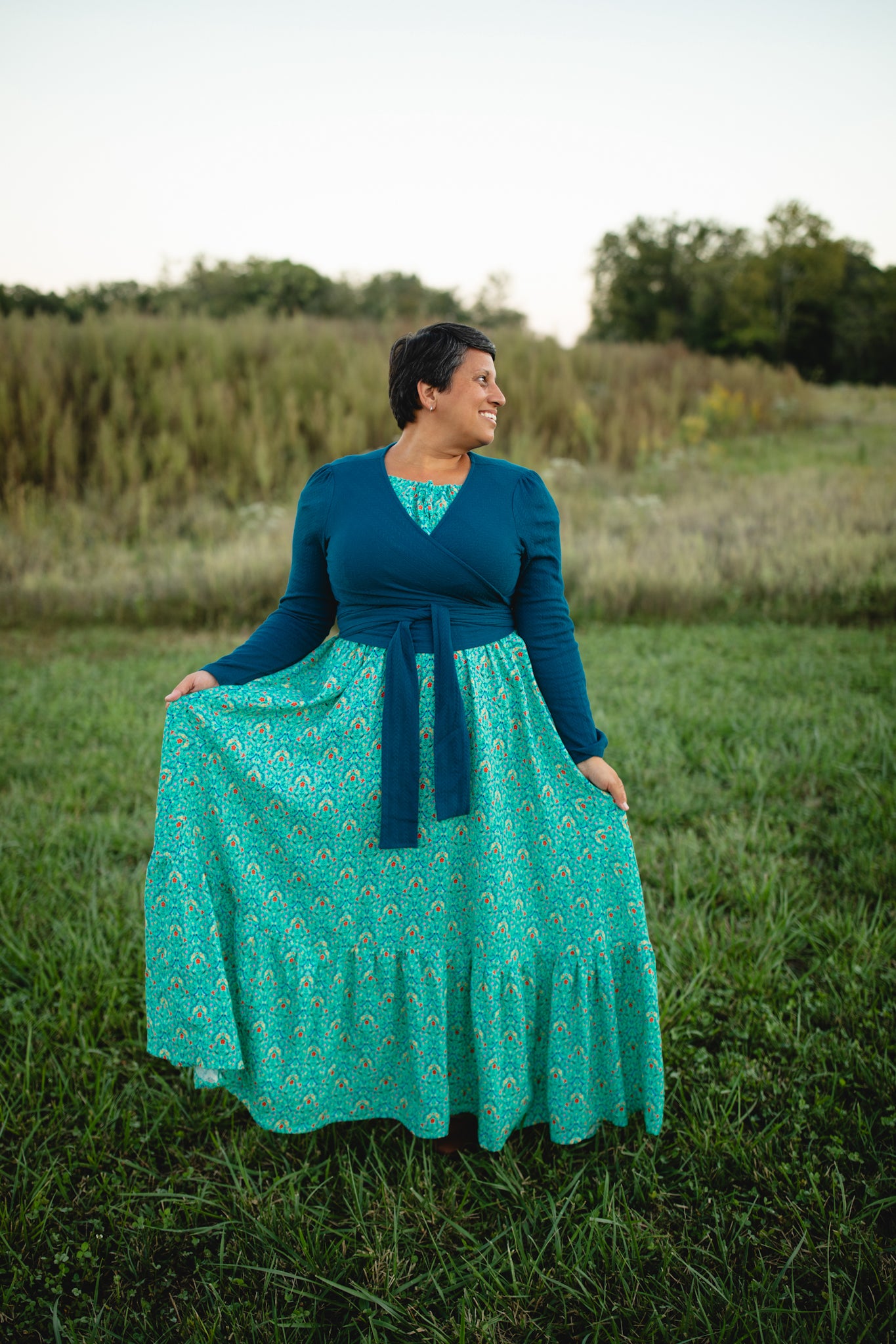 Woman in modest nursing teal dress with cardigan