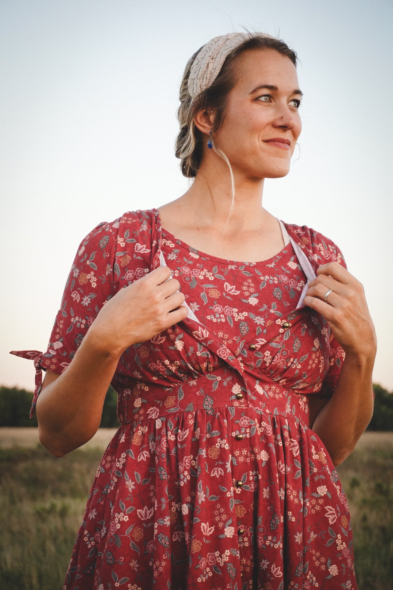 Woman in modest nursing red floral dress outdoors