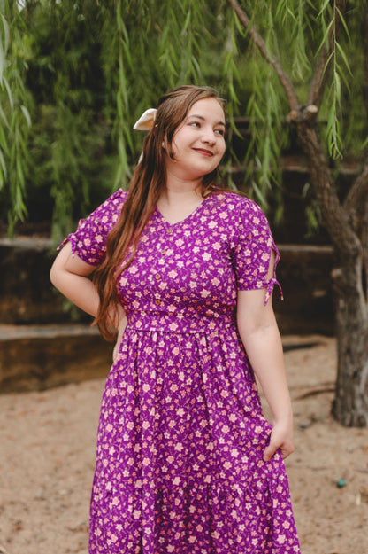 Woman in modest nursing floral dress outdoors
