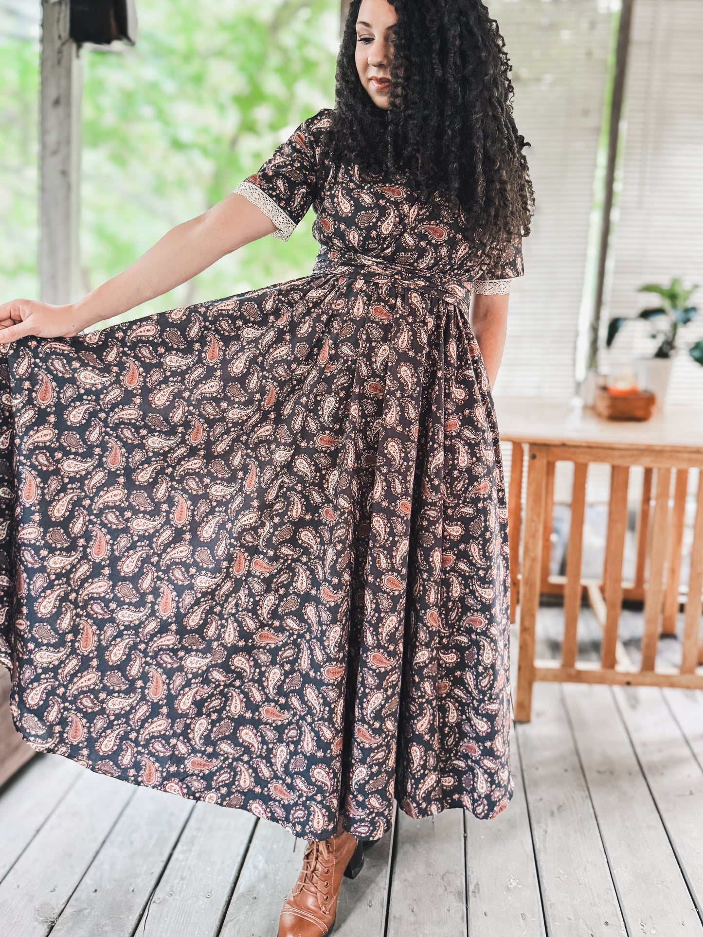 Woman in modest nursing floral dress on deck