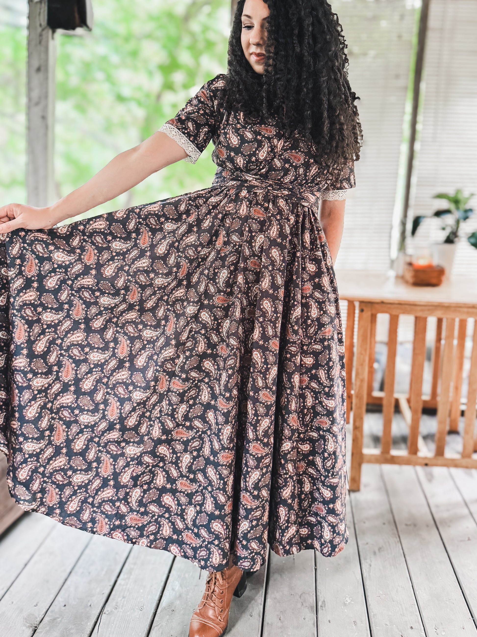 Woman in modest nursing floral dress on deck