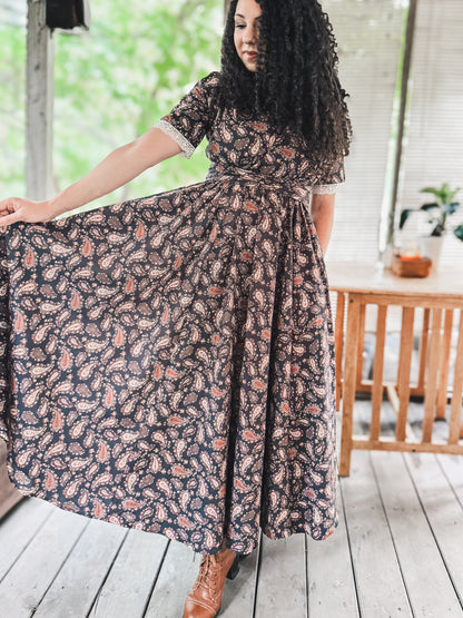 Woman in modest nursing floral dress on deck
