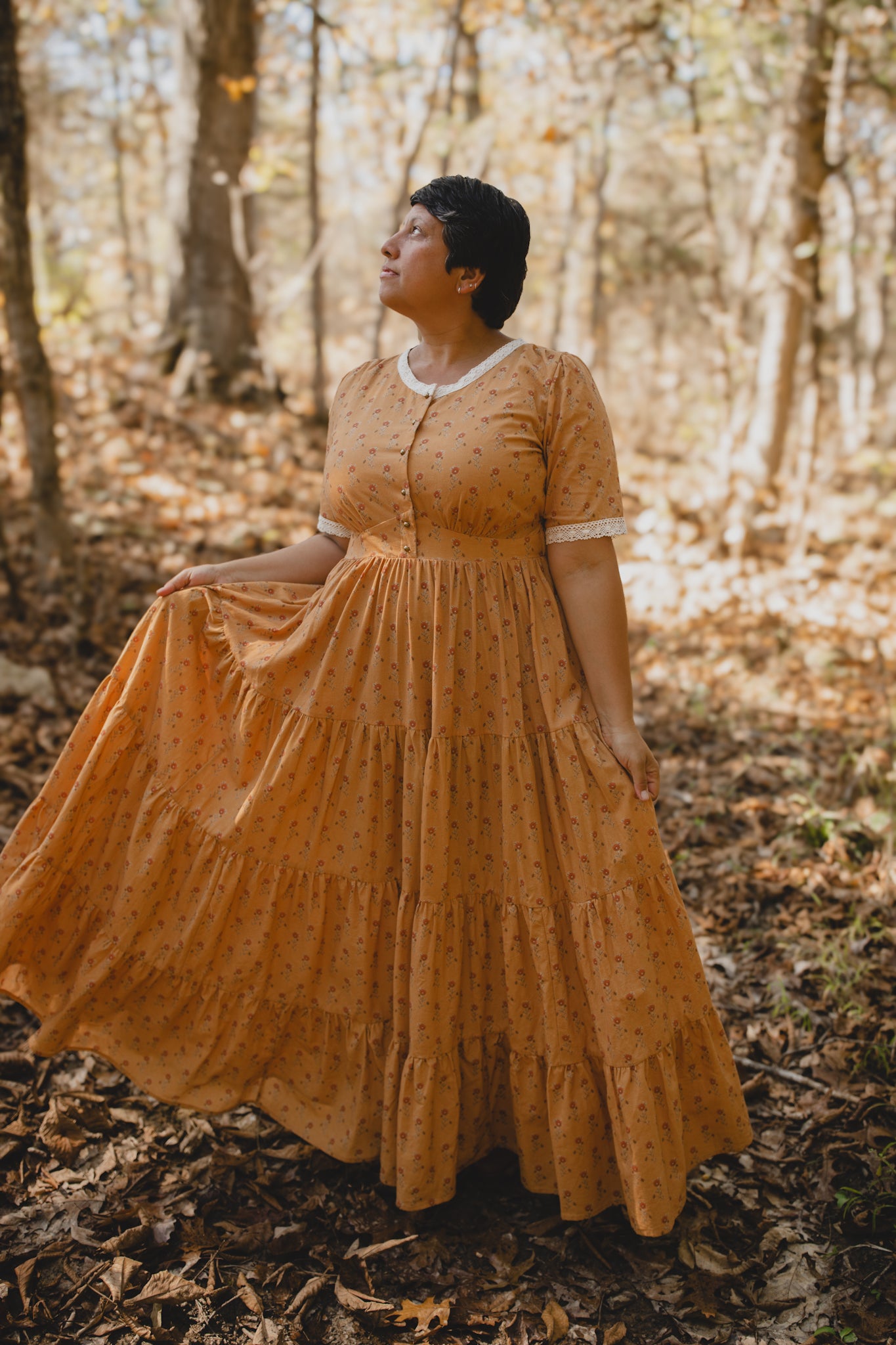 Woman in modest nursing dress standing forest
