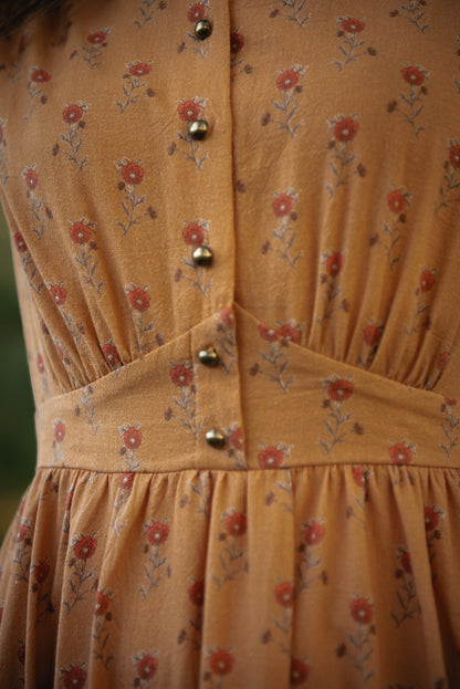 Close-up of modest nursing dress with buttons