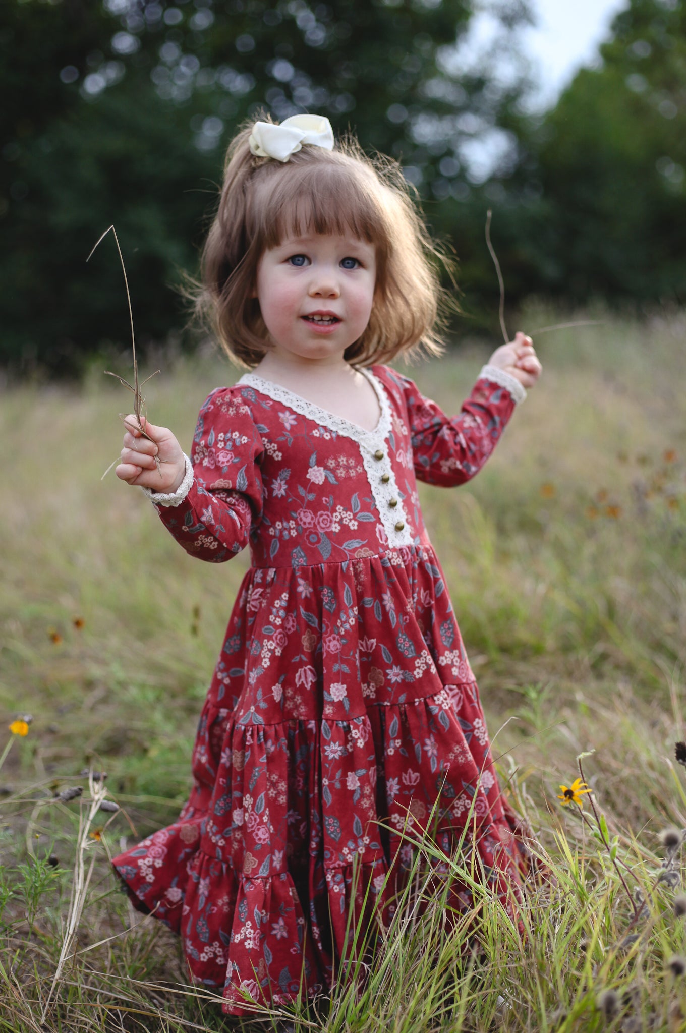 Young girl in modest red floral dress outdoors