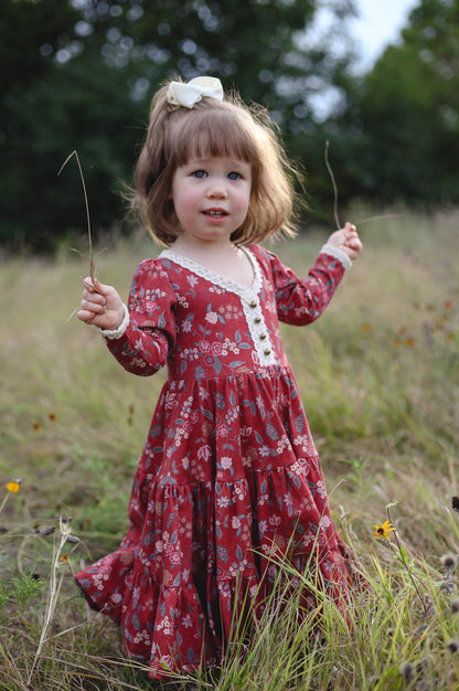 Young girl in modest red floral dress outdoors