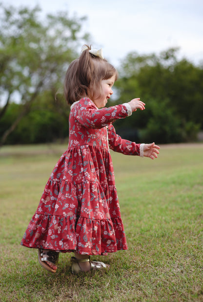 Girl in modest red floral dress outdoors