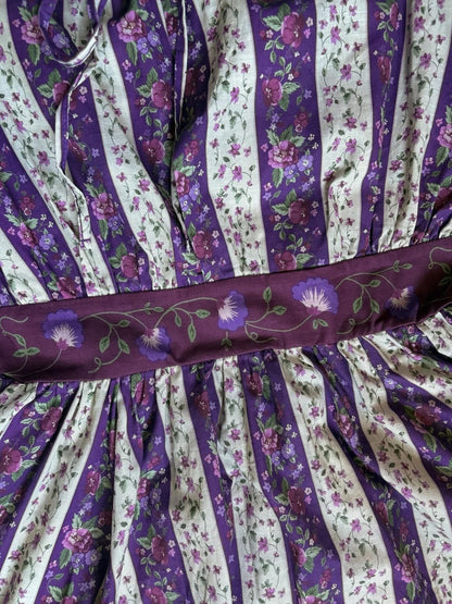 Purple and white striped fabric with floral patterns