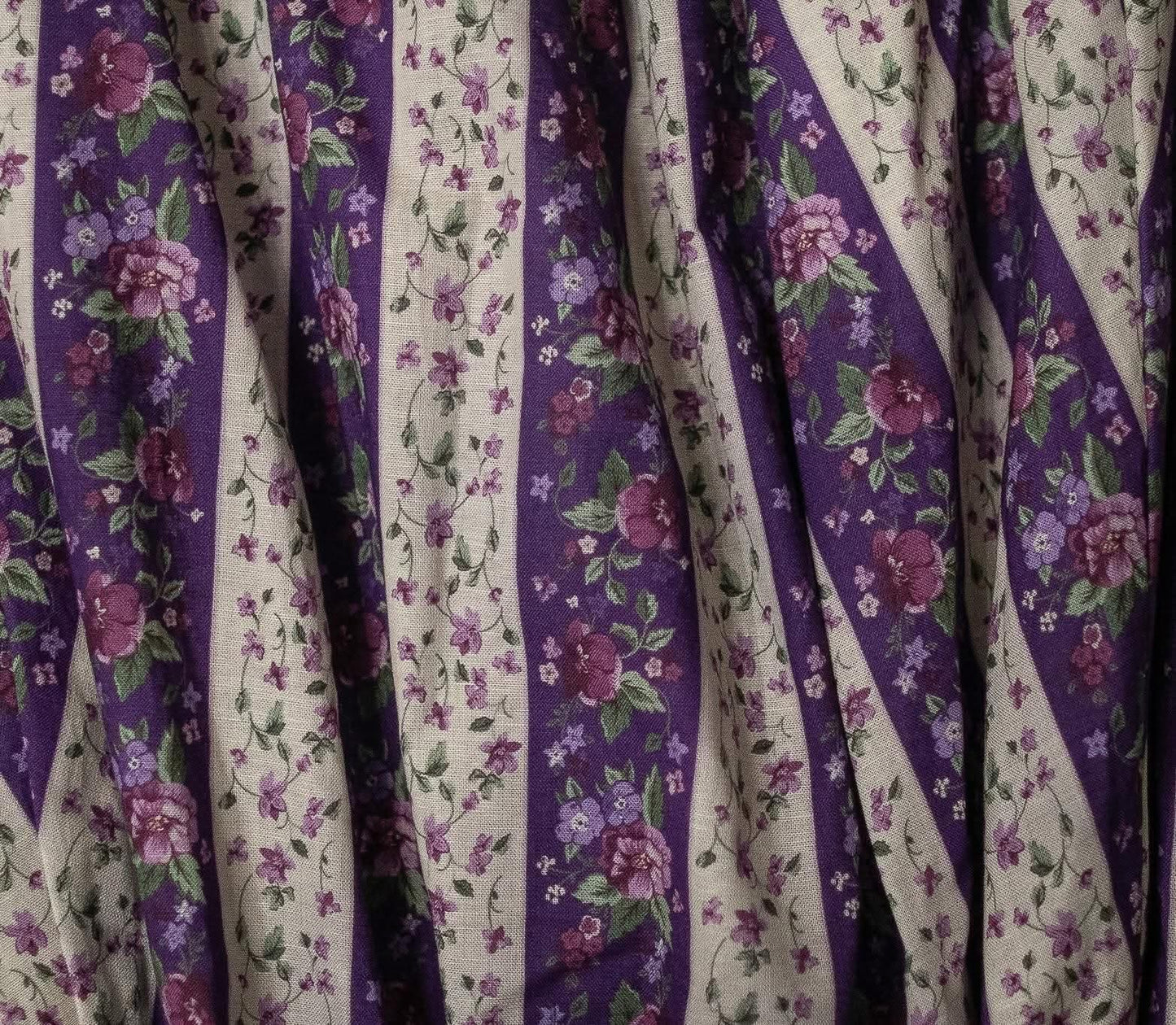 Floral patterned fabric with purple and white stripes