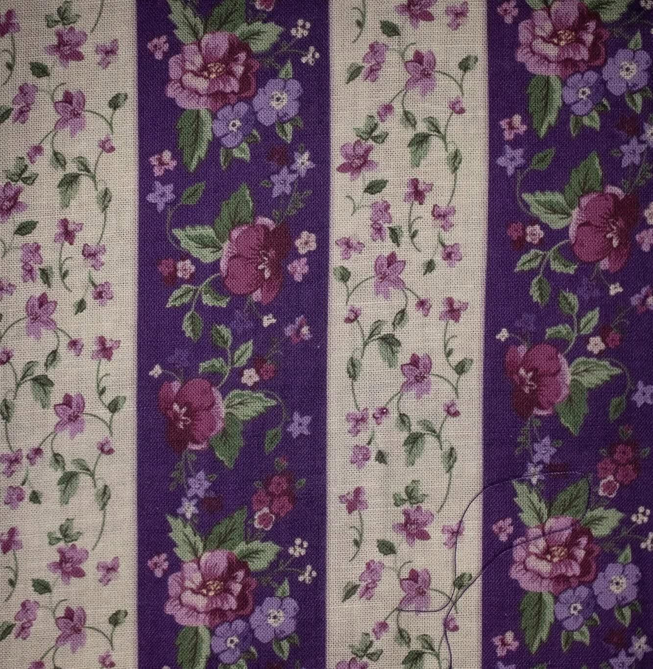 Floral patterned fabric with purple and white stripes