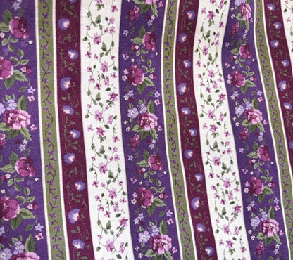 Striped fabric with floral patterns in purple, green, and white.
