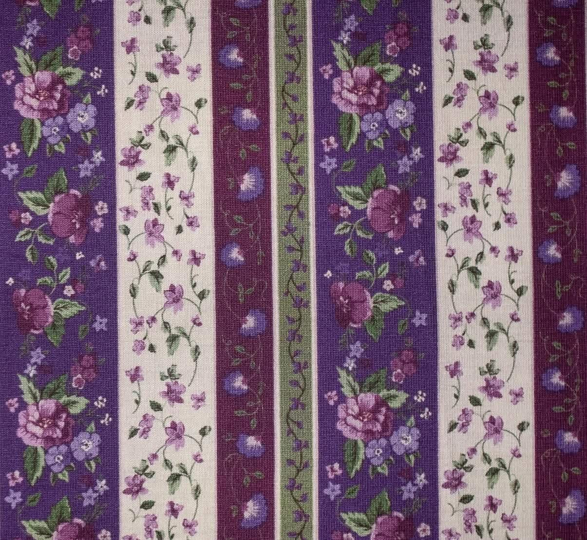 Striped fabric pattern with floral design in purple, green, and white.