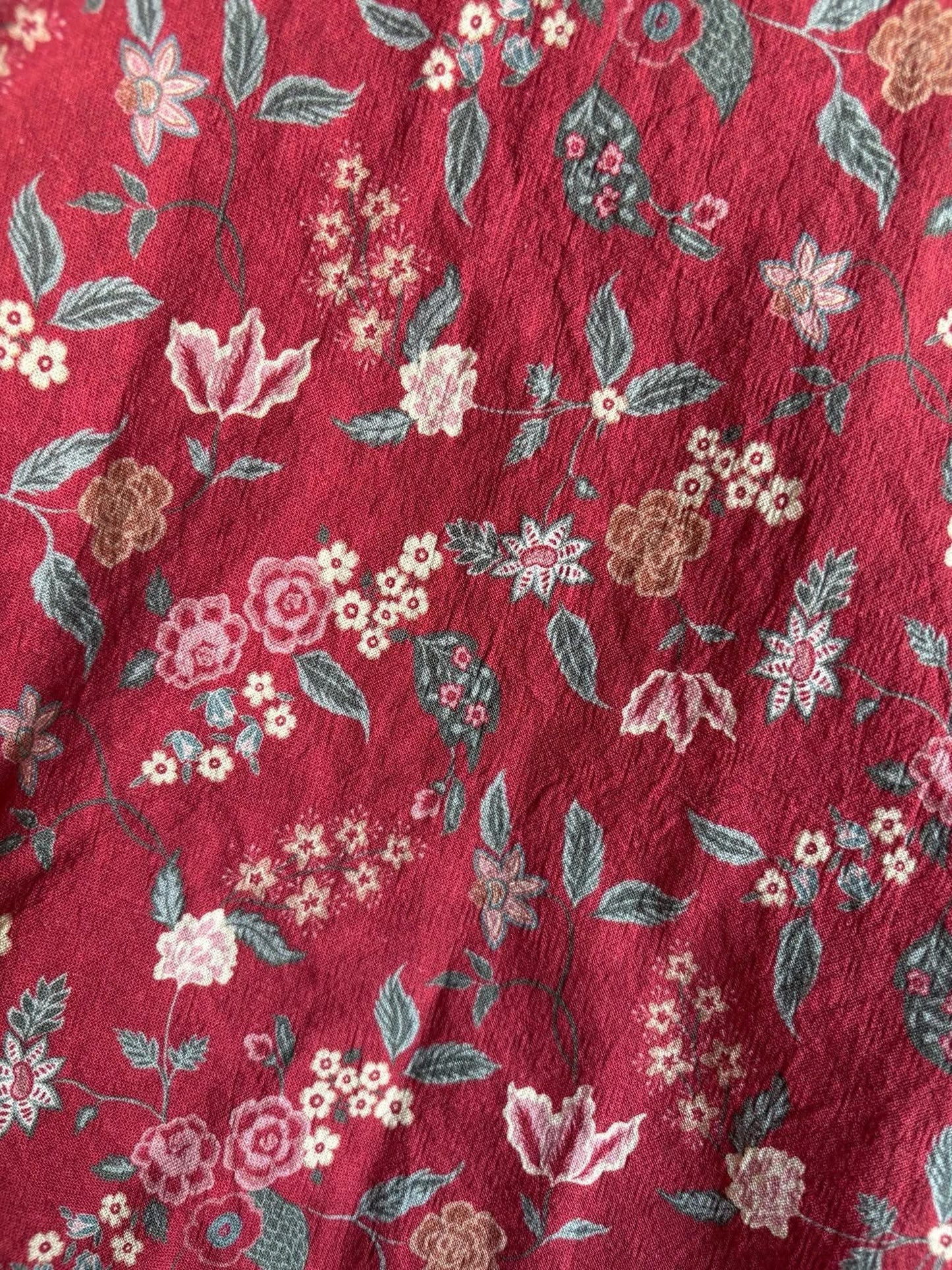 Red floral pattern fabric detail