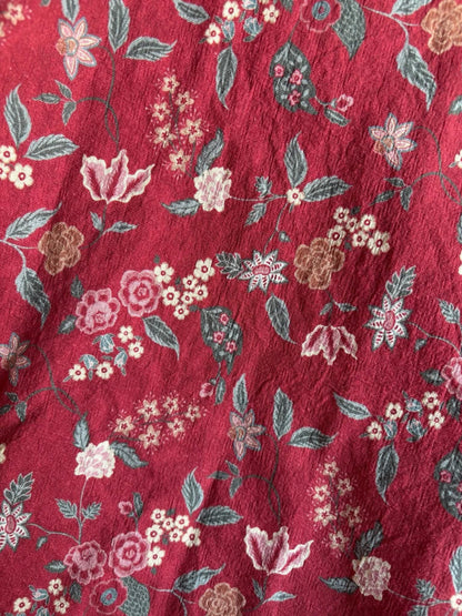 Red floral pattern fabric detail